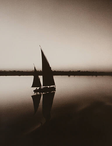 A Felucca Glides on the Ancient River (Nile River, Nubia)