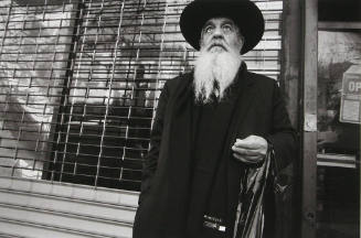 Man in front of Storefront