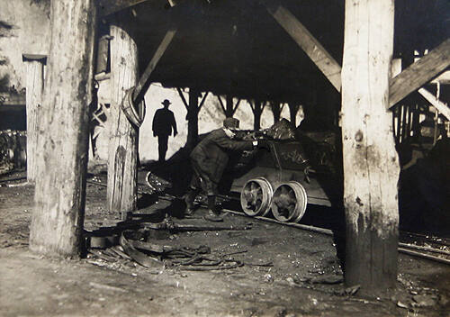 Young Boy Pushing Coal Car