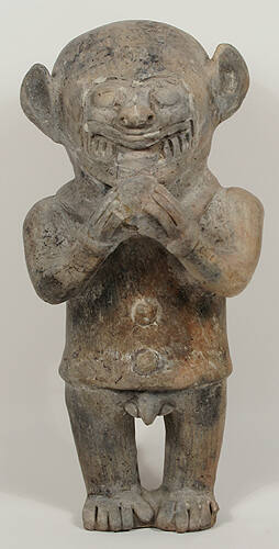 Jaguar Figure Holding a Ball