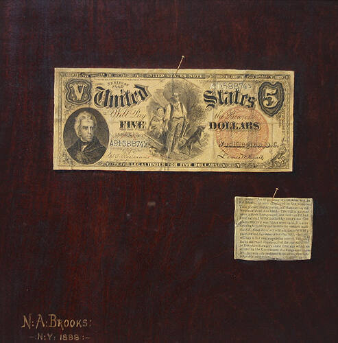 A Five-Dollar Bill and Newspaper Clipping